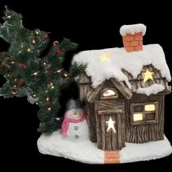 WGP MGO Wood Effect Snowing House With Snowman And LED Christmas Tree. CLICK AND COLLECT ONLY AVAILABLE FOR THIS ITEM.