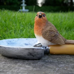 Dutch Brothers Bird Sitting On A Shovel Feeder